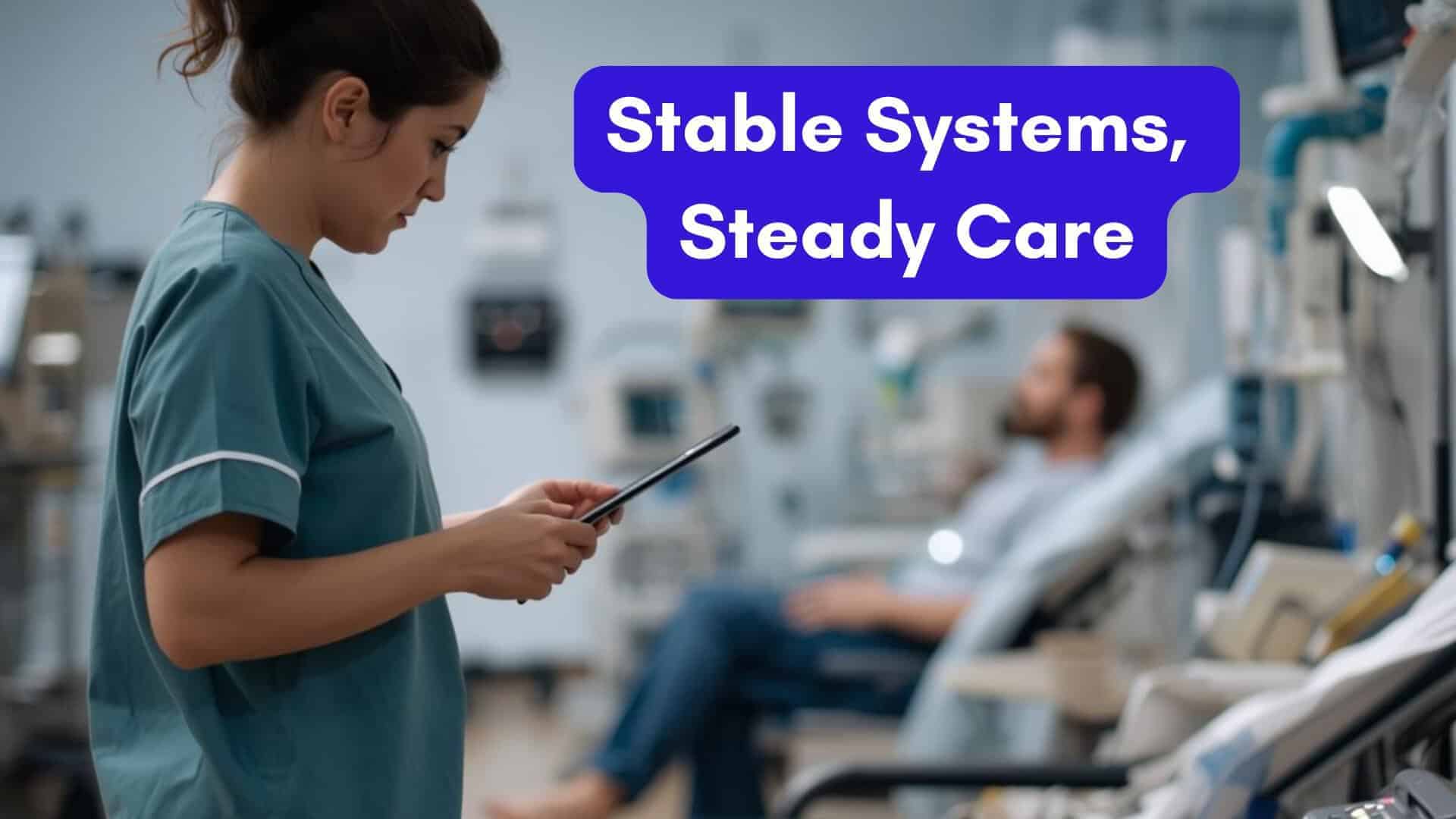 A nurse or technician checking a tablet or laptop near a row of dialysis chairs, with a patient in the background, monitors softly glowing