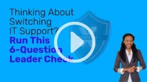 Video thumbnail with bright blue background. Large text reads &ldquo;Thinking About Switching IT Support? Run This 6-Question Leader Check.&rdquo; A faded shield icon in the center shows an &ldquo;X&rdquo; and the word &ldquo;UNVERIFIED.&rdquo; A large play button in the foreground. A smiling woman presenter in a blazer on the right side.
